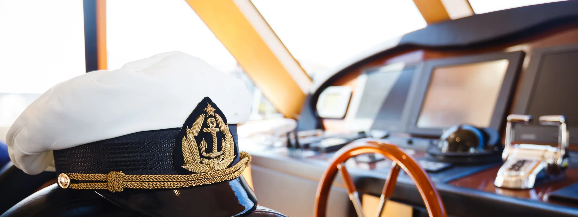 A yacht Captain at the helm