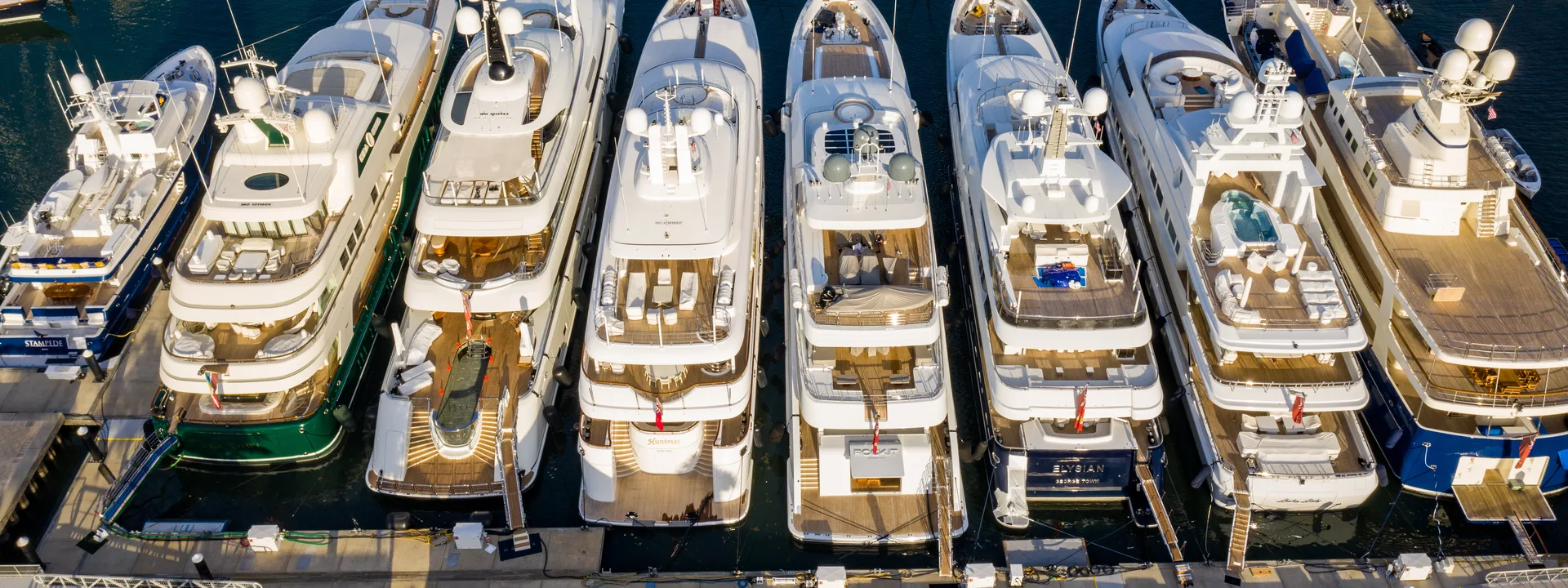 A fleet of yachts moored in a marina